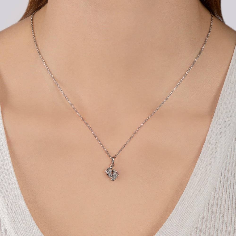 Hallmarkfinejewelry Baby Feet Pendant in Sterling Silver with 1/10 Cttw of Diamonds