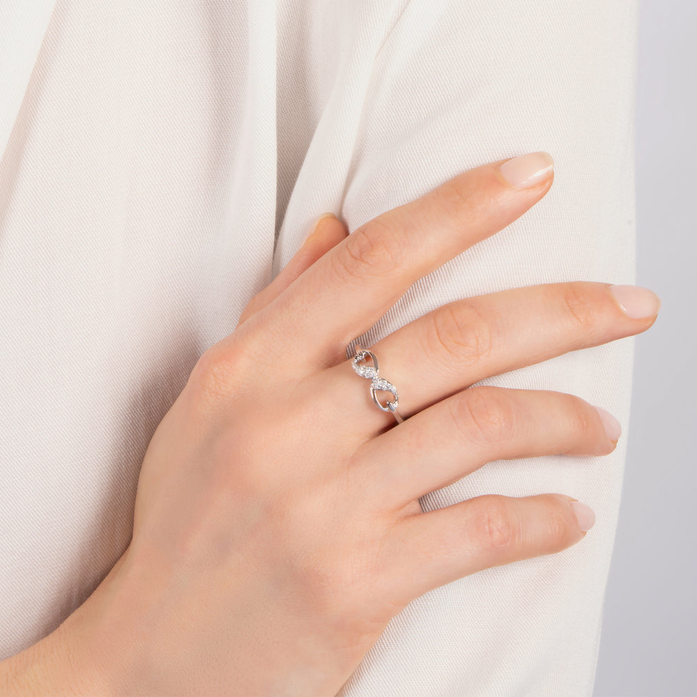 Hallmarkfinejewelry Contemporary Infinity Ring in Sterling Silver with 1/10 Cttw of Diamonds
