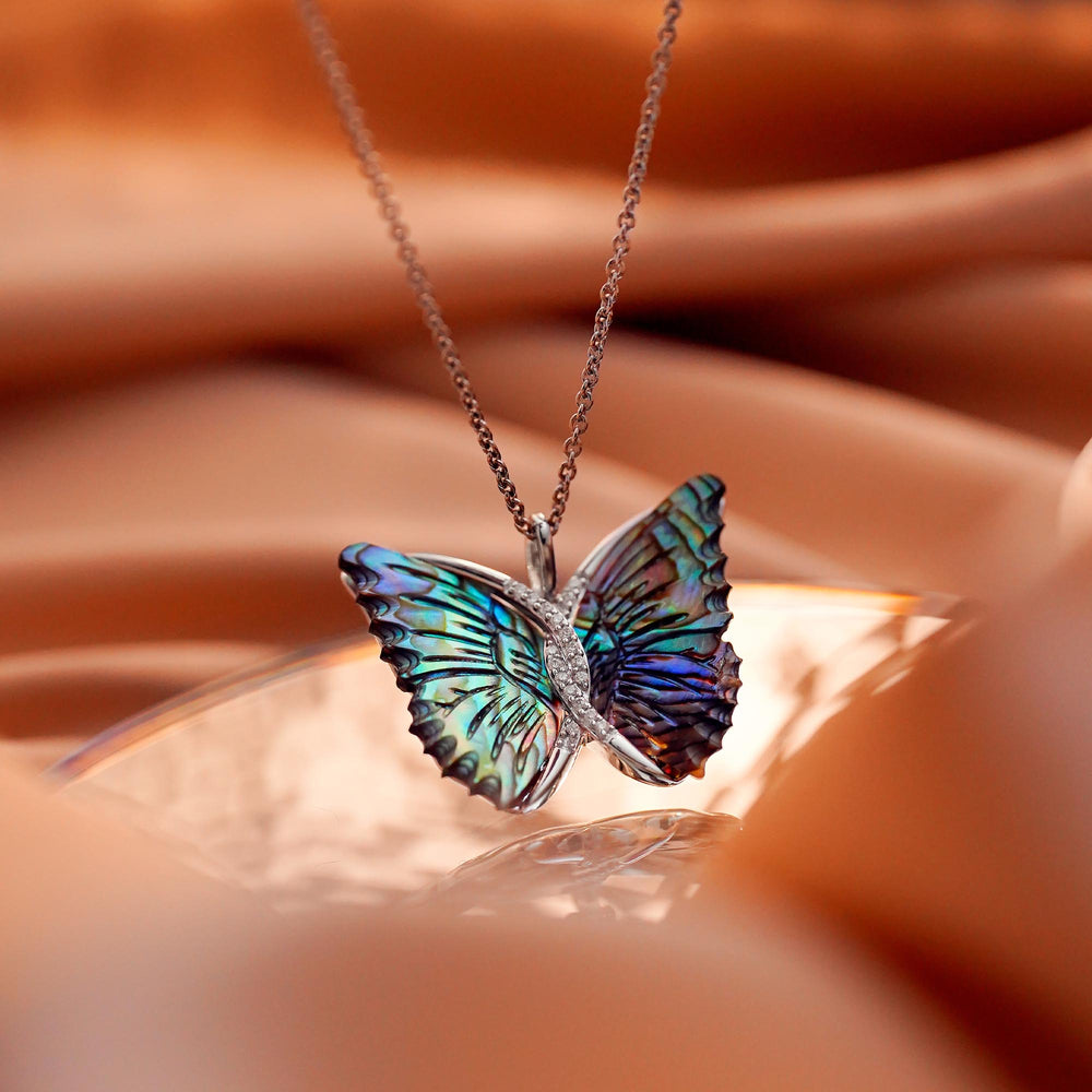 Hallmarkfinejewelry Social Butterfly Pendant in Aurora Borealis Blue Carved Mother of Pearl and Sterling Silver with Diamonds